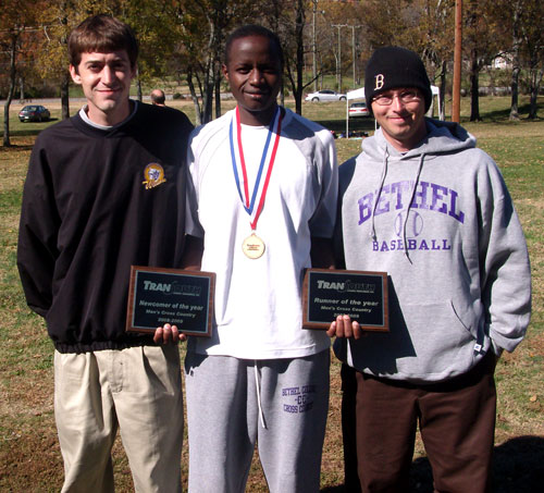 Nelphat Bor qualifies for Nationals.  He is joined by coaches Brandon Kilburn & Rusty Thompson.