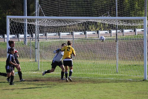 Bethel's #2 Sarah Hasall puts away a header for her first goal of the season against Crichton College.