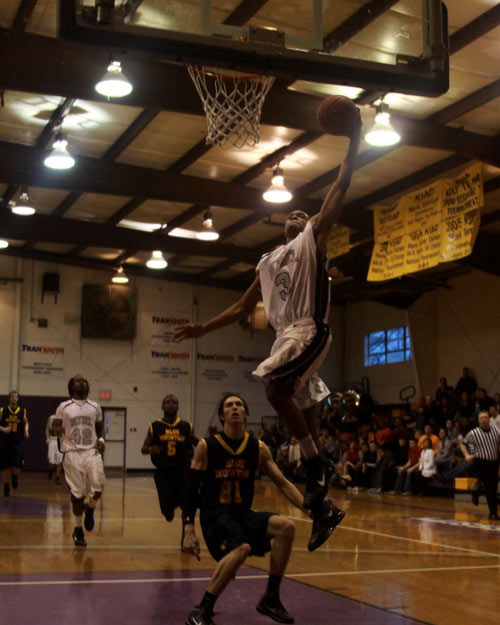 BU's Eddie King slams one home for the Wildcats in their win over Blue Mountain College.