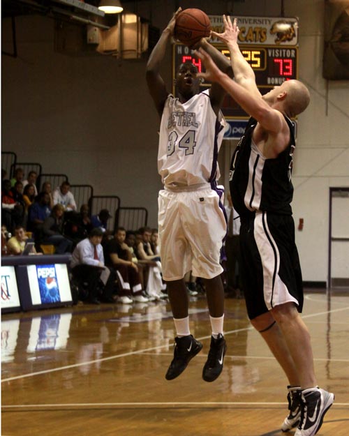Bethel's Erin Harris hits a jump shot over Freed-Hardeman's Zack Frey