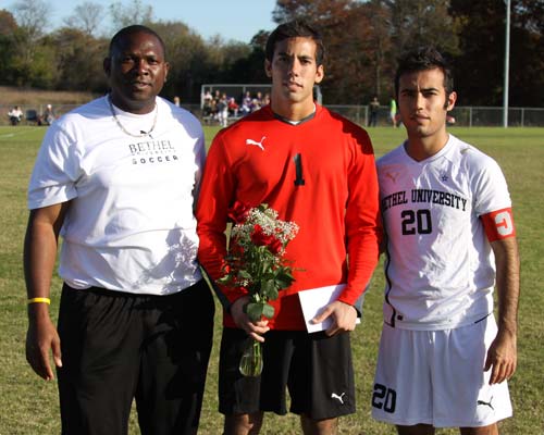 Massimo Collu-Marchese (center) was honored as Bethel's lone senior on Senior Day