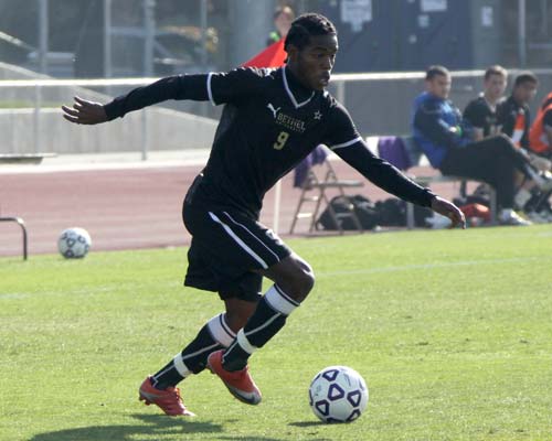 Bethel's Dwayne Smith pushes the ball toward the offensive end against Simon Fraser. Smith led the Wildcats with 5 shots.