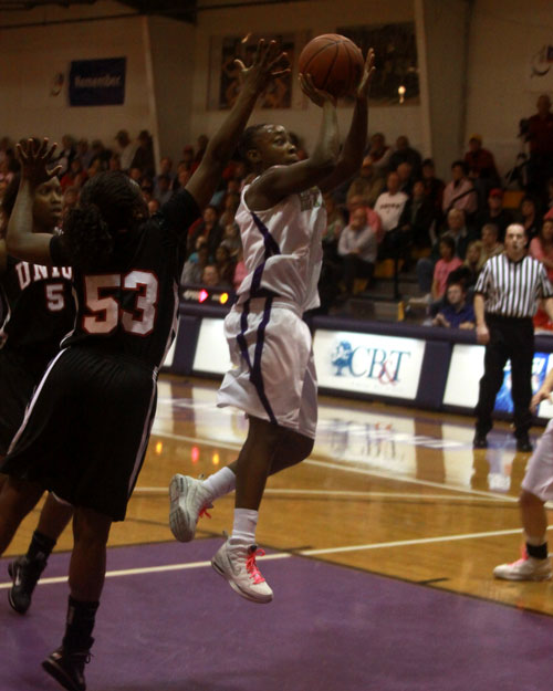 Kashundria Berry drives the lane for two of her career high 26 points.