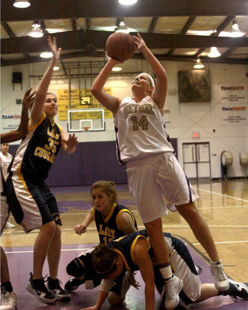 Let the bodies hit the floor, Jana Roney gets a basket the hard way in the win over MCU.